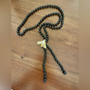 Elegant Black Beaded Necklace with Gold and Crystal Bee Pendant